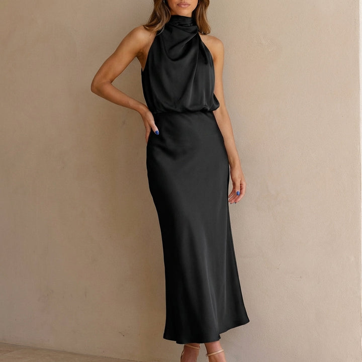 Formal sleeveless draped halter midi dress for women. Chic blouson waist, ideal for special occasions.