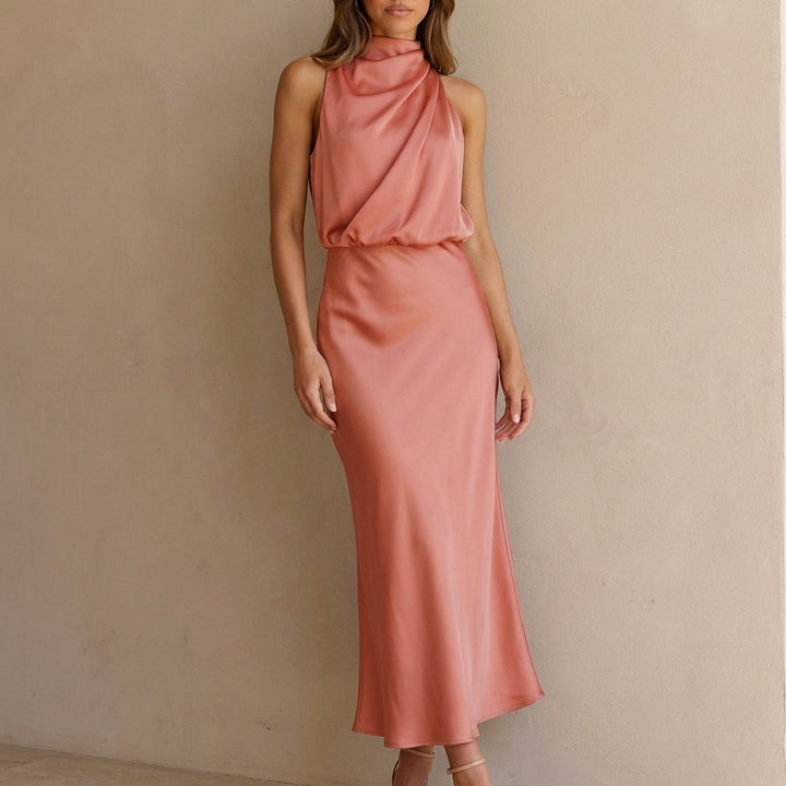 Women's cocktail dress with a draped halter neck & flattering blouson waist. Formal occasion wear.