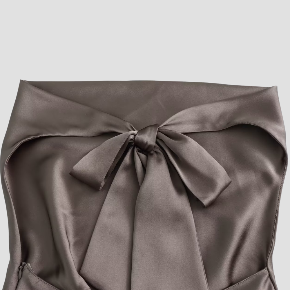 Sleeveless women's evening top featuring a stylish draped halter neck design.
