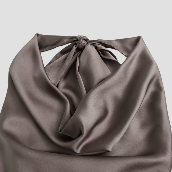 Fashionable women's apparel: a chic draped halter tank for sophisticated style.