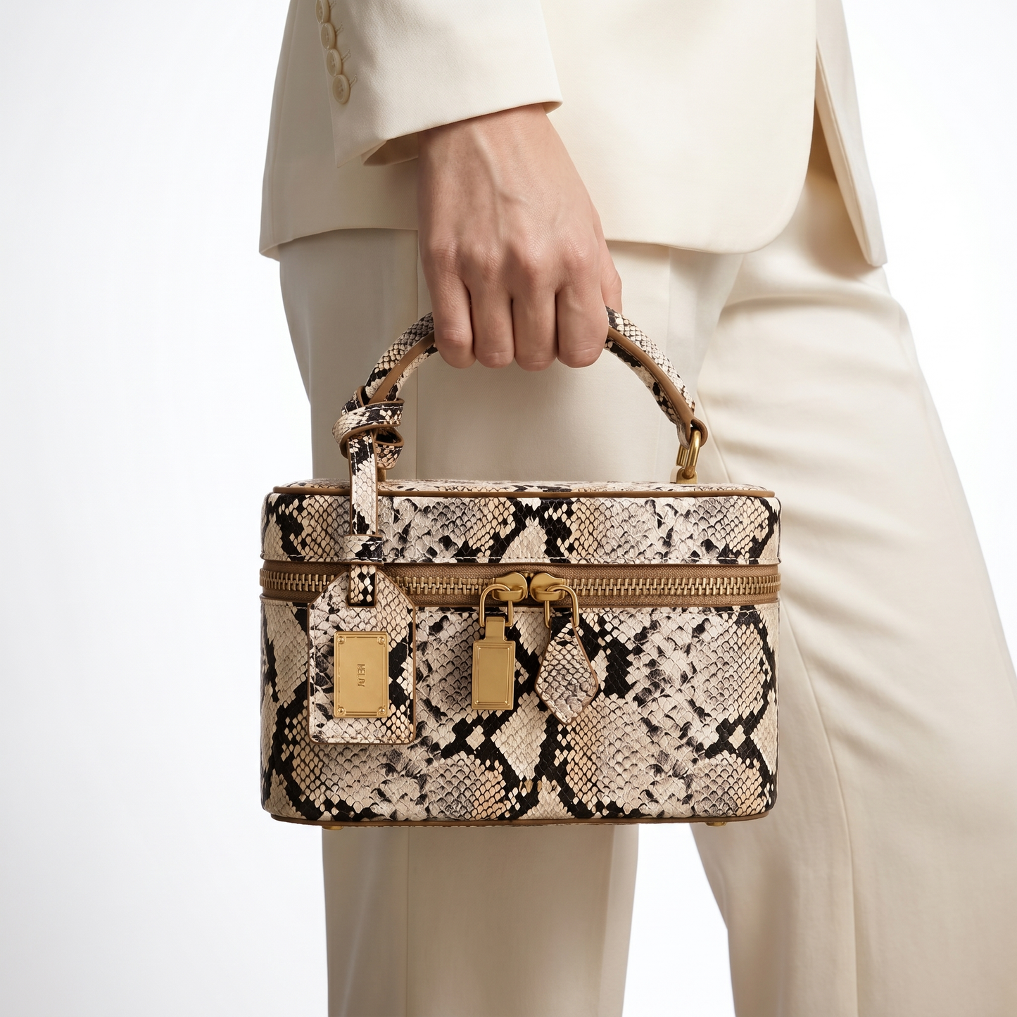 Structured box handbag with elegant embossed faux leather finish for women.