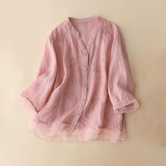 Women's elegant embroidered V-neck blouse, perfect for chic spring & summer outfits. Breathable fabric.