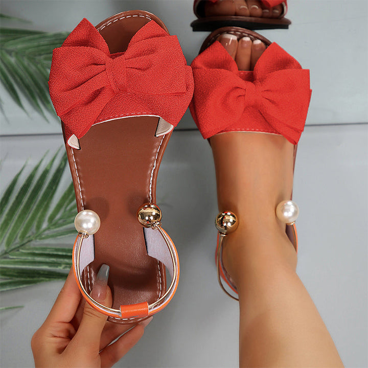 Versatile women's summer flat sandals with stylish bow & sparkling bead embellishments.