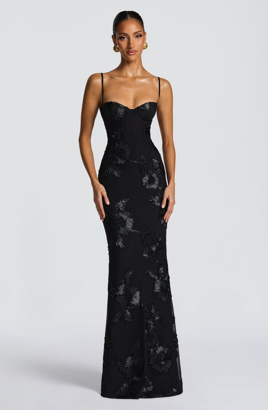 Full length view of a floral appliqué corset mermaid maxi formal dress with elegant train. Special occasion evening gown.