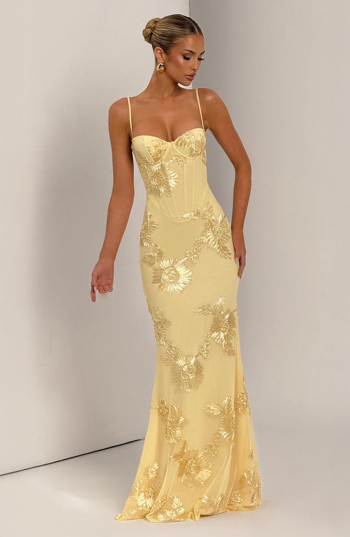 Gorgeous mermaid prom dress with floral appliqué and corset top. Elegant maxi gown for a memorable special occasion.