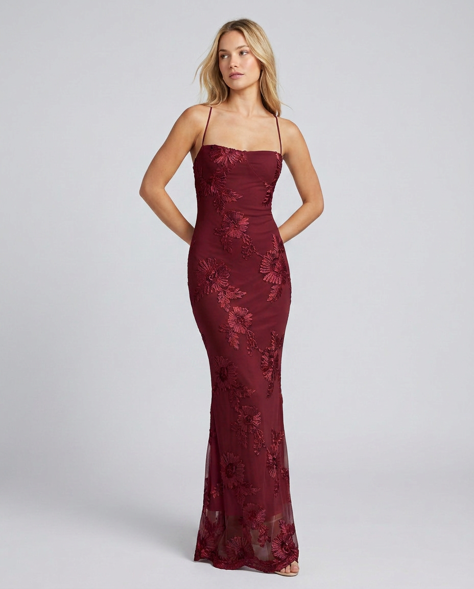 Sophisticated women's floral appliqué evening gown, complete with an elegant lace-up back. Formal dress.