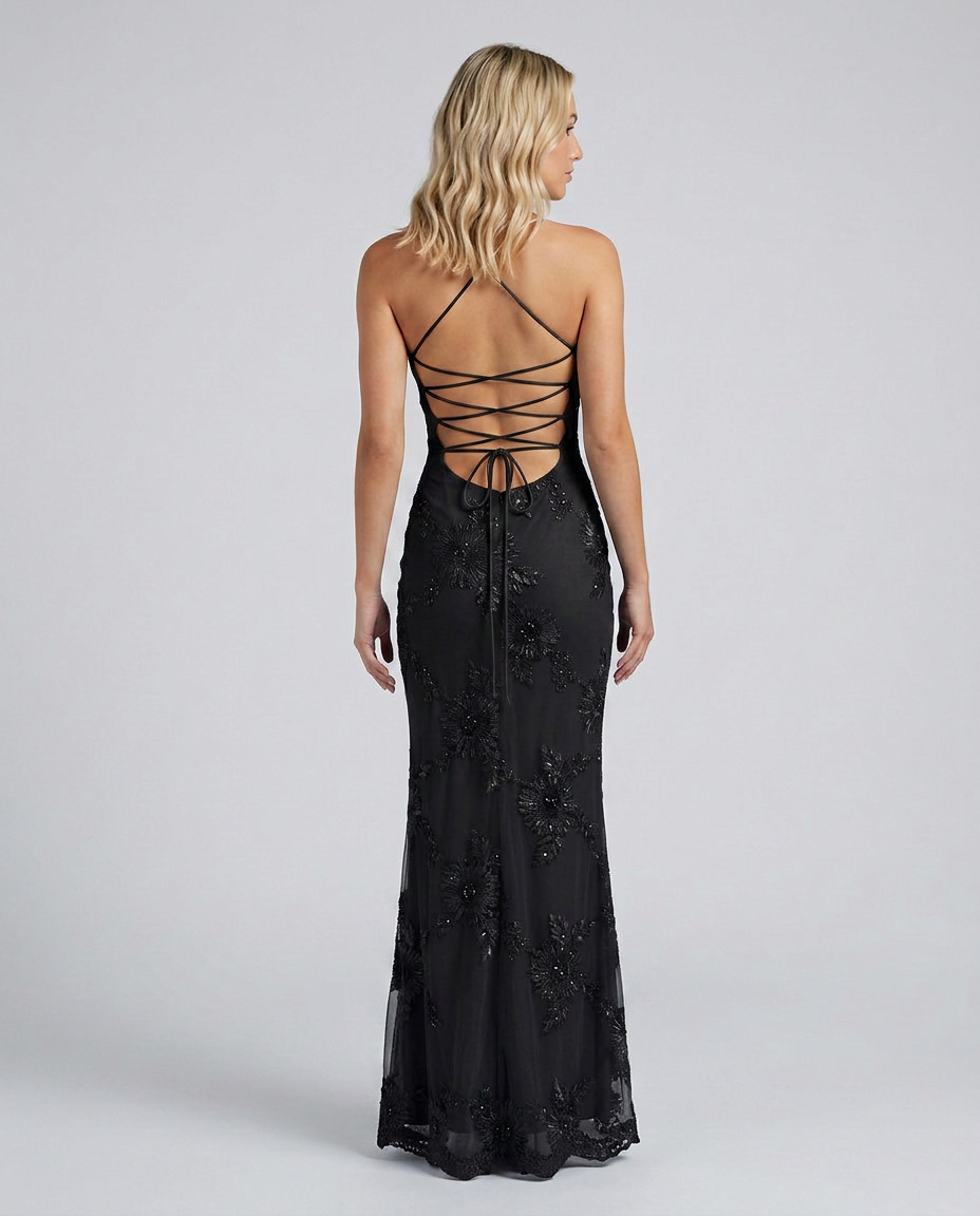 Close-up of the elegant lace-up back on a women's floral appliqué maxi dress. Detailed party evening gown.