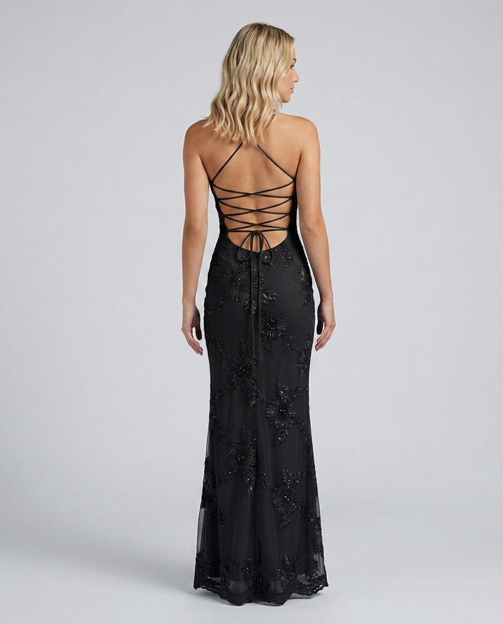 Close-up of the elegant lace-up back on a women's floral appliqué maxi dress. Detailed party evening gown.