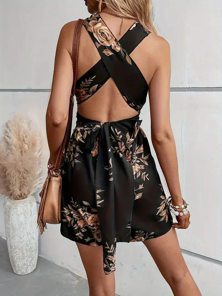 Women's chic floral dress romper, open back design with halter neck, perfect for summer parties.