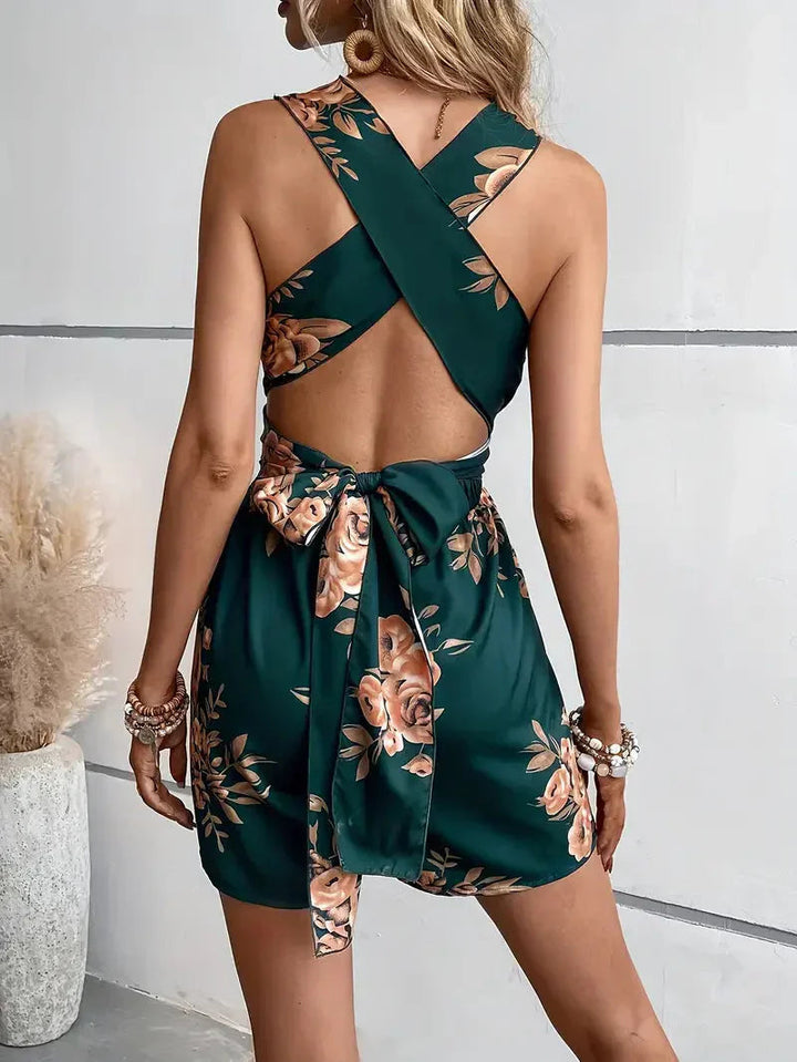 Stylish women's floral dress romper with an alluring open back, perfect for casual elegant parties.