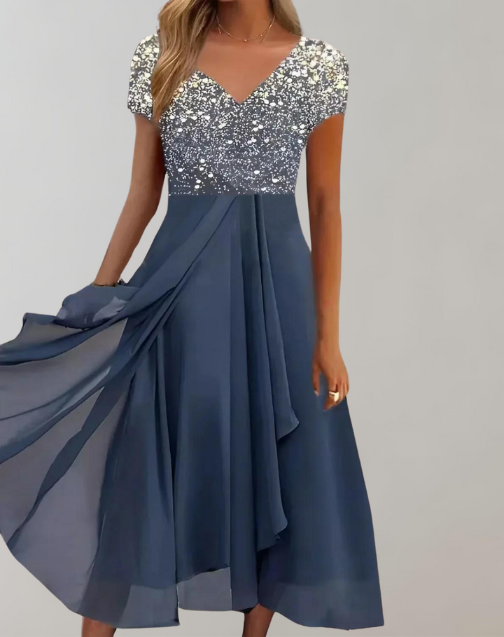 Glamorous women's embellished midi dress with delicate floral details, ideal for formal parties.