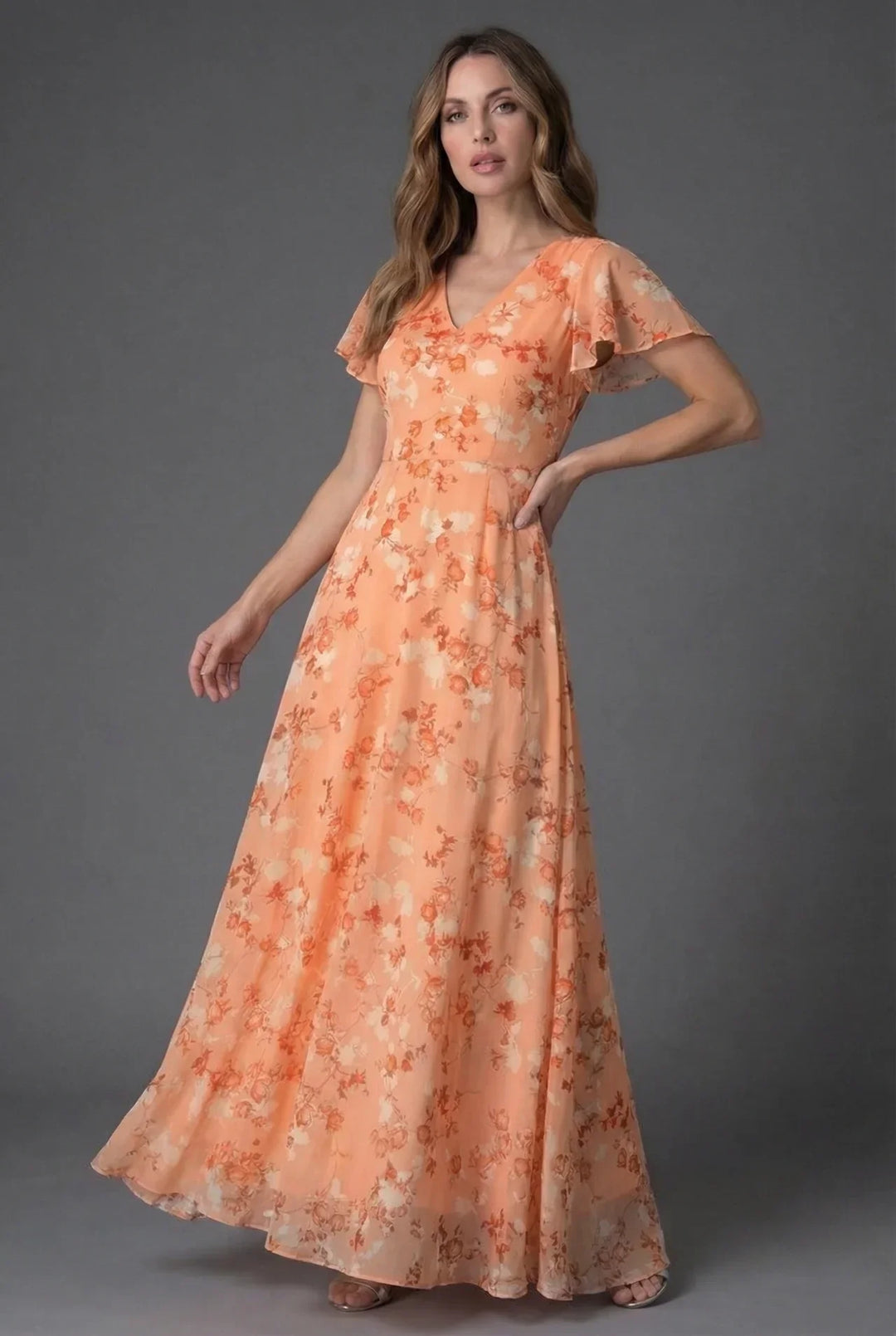 Chic women's floral V-neck maxi dress with flutter sleeves, great for summer fashion & elegant events.