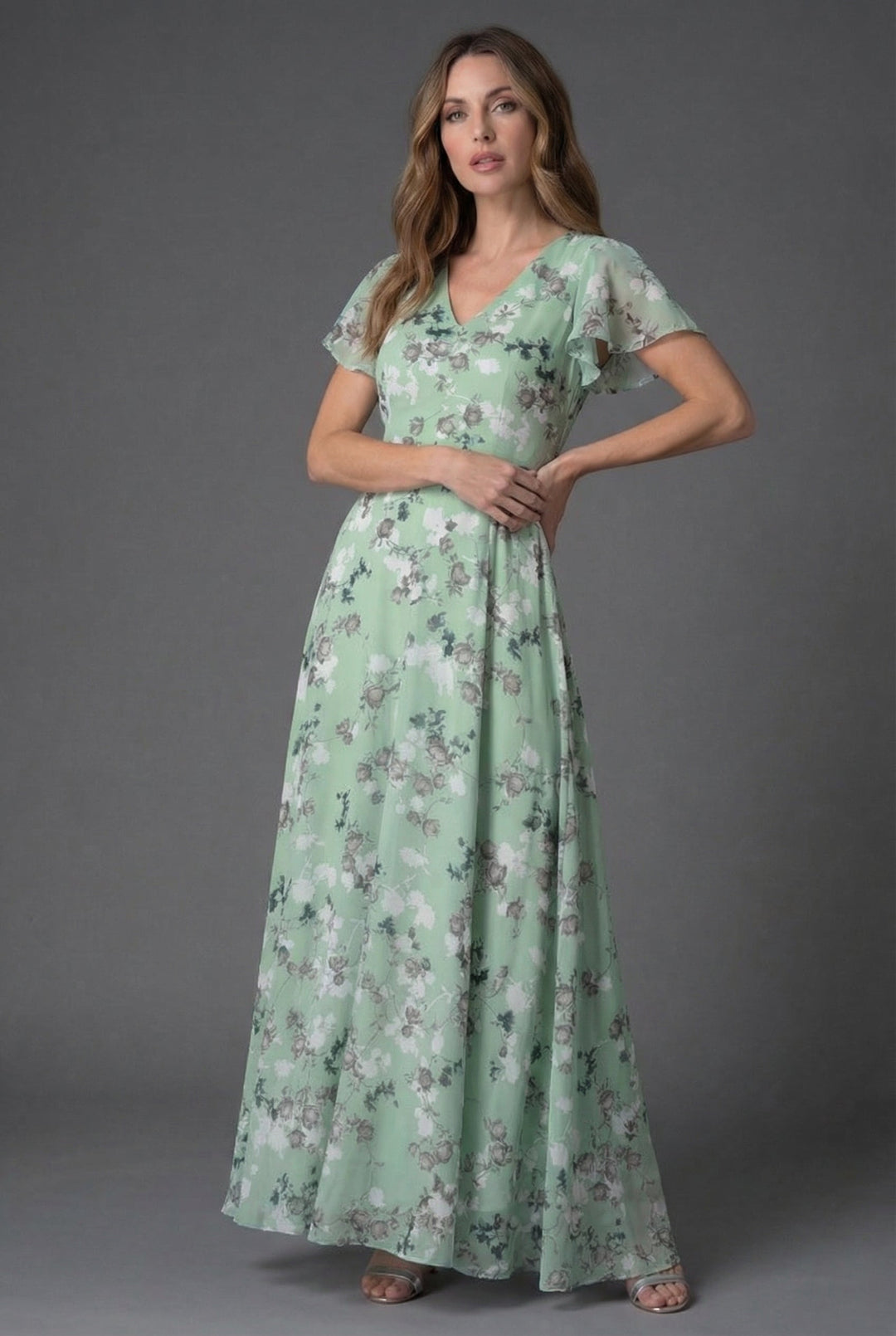 Stunning women's floral pattern maxi dress with delicate flutter sleeves and V-neck, spring fashion.