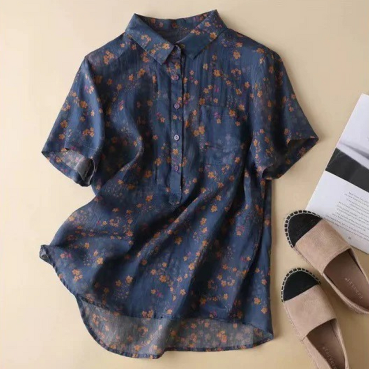 Stylish women's floral blouse featuring a half-placket & button detail, perfect for elegant casual spring outfits.