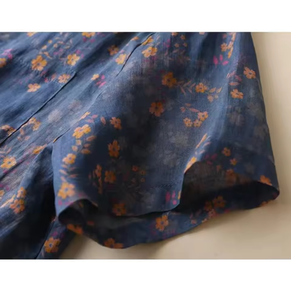 Elegant women's floral blouse with a half-placket, a versatile short-sleeve top for spring & summer style.