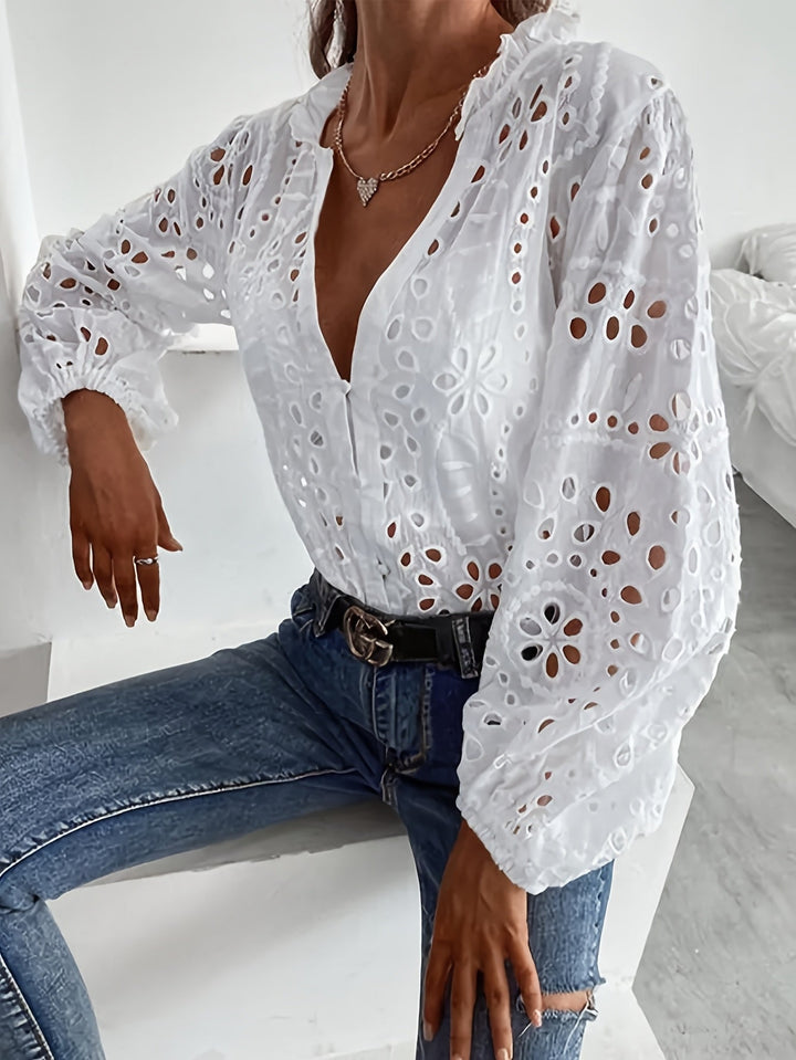 Stylish women's long-sleeve floral blouse with button closure, ideal for adding elegance to any outfit.