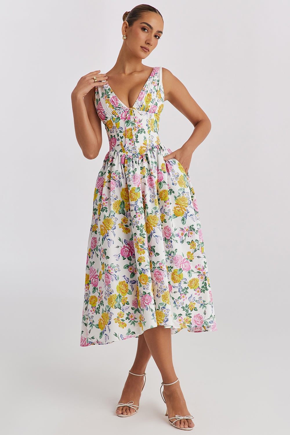 Women's elegant floral midi wedding guest dress with corset bodice, V-neck, and A-line skirt. Perfect for garden parties.