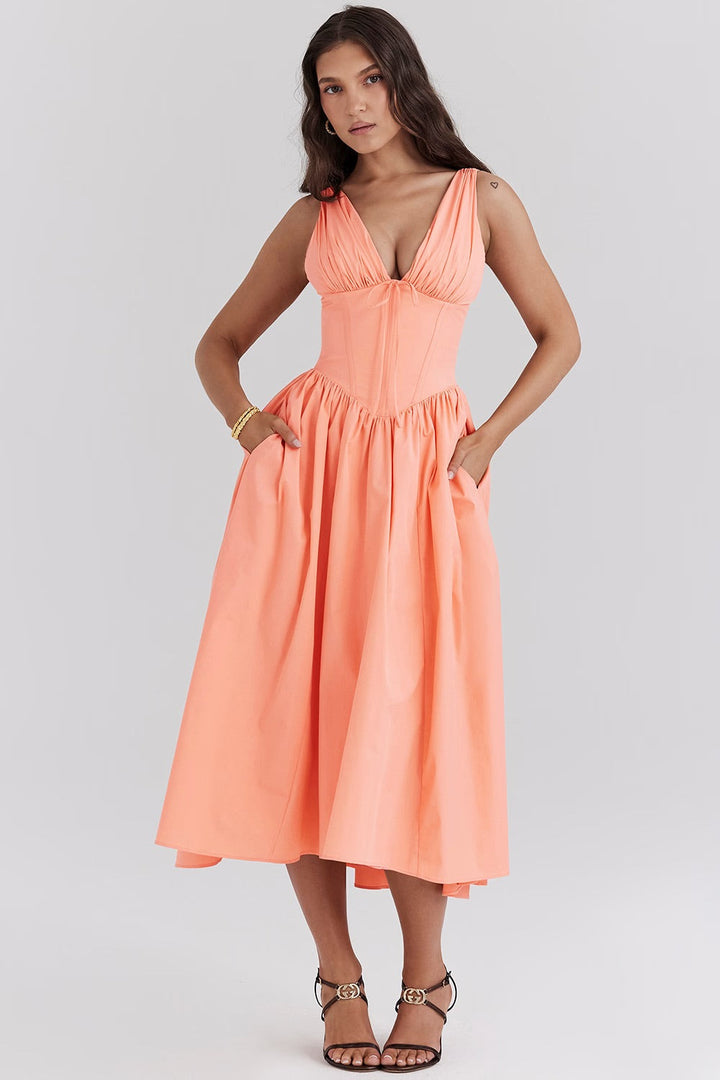 Stylish women's floral midi wedding guest dress, A-line cut with V-neck and corset details, for summer events.