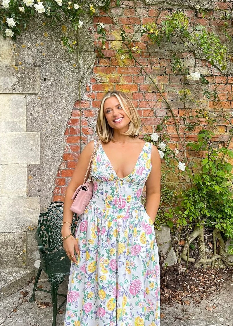 Beautiful floral print midi dress for women, featuring a flattering V-neck, corset bodice, and flowy A-line.