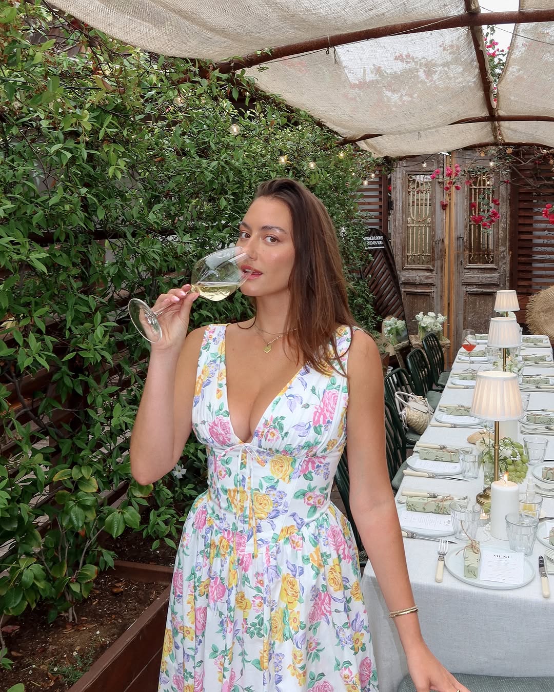 Delicate women's floral A-line midi dress, V-neck, corset bodice, ideal elegant summer party or wedding guest attire.