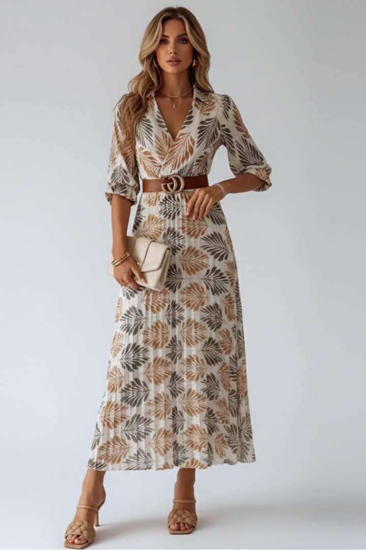 Flowy women's summer maxi dress featuring a vibrant floral pattern and comfortable elbow sleeves.