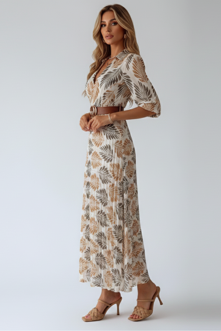 Stylish women's patterned maxi dress with a beautiful floral design and practical elbow sleeves.