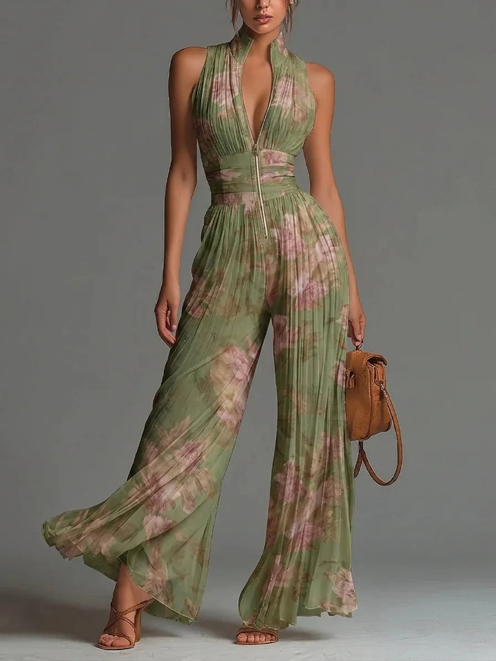 Women's elegant floral pleated halter jumpsuit with wide legs, perfect for summer vacations & parties.
