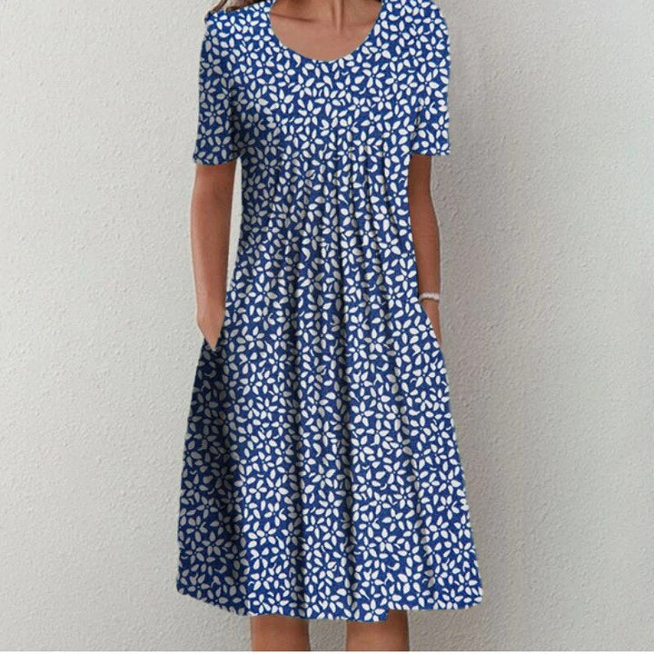 Women's flattering floral print dress offering tummy coverage, ideal for elegant everyday style.
