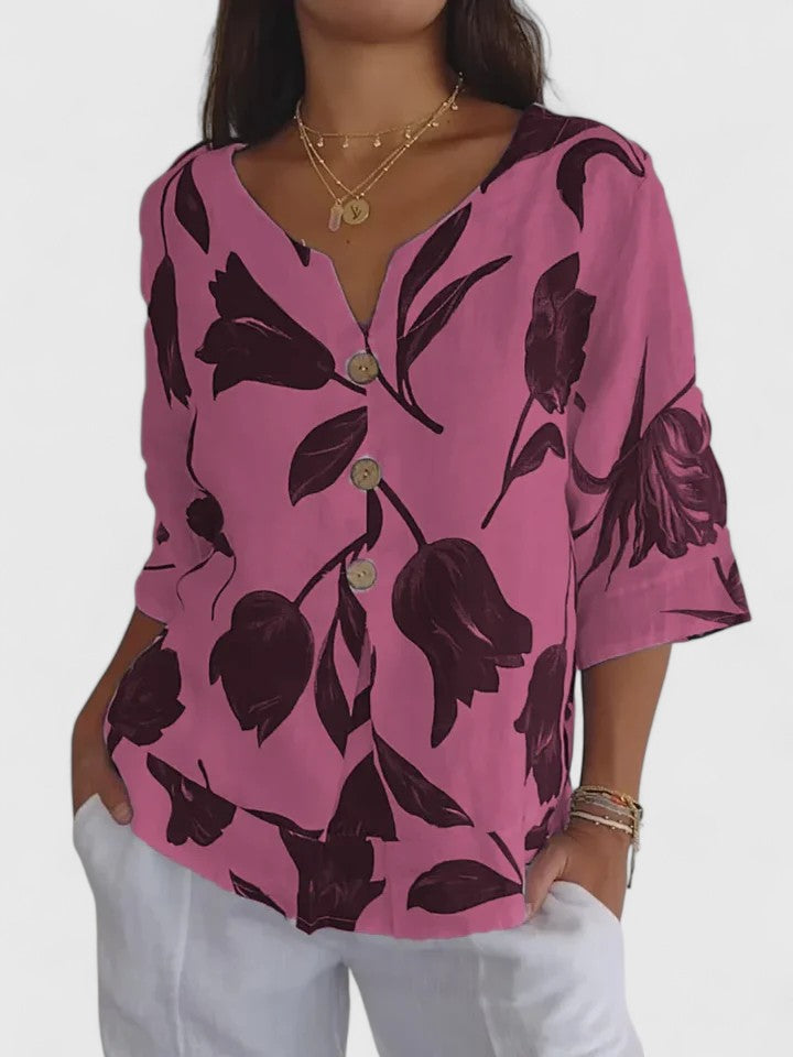 Stylish women's floral V-neck blouse with a relaxed fit. Elegant long-sleeve top for comfortable casual and dressy wear.