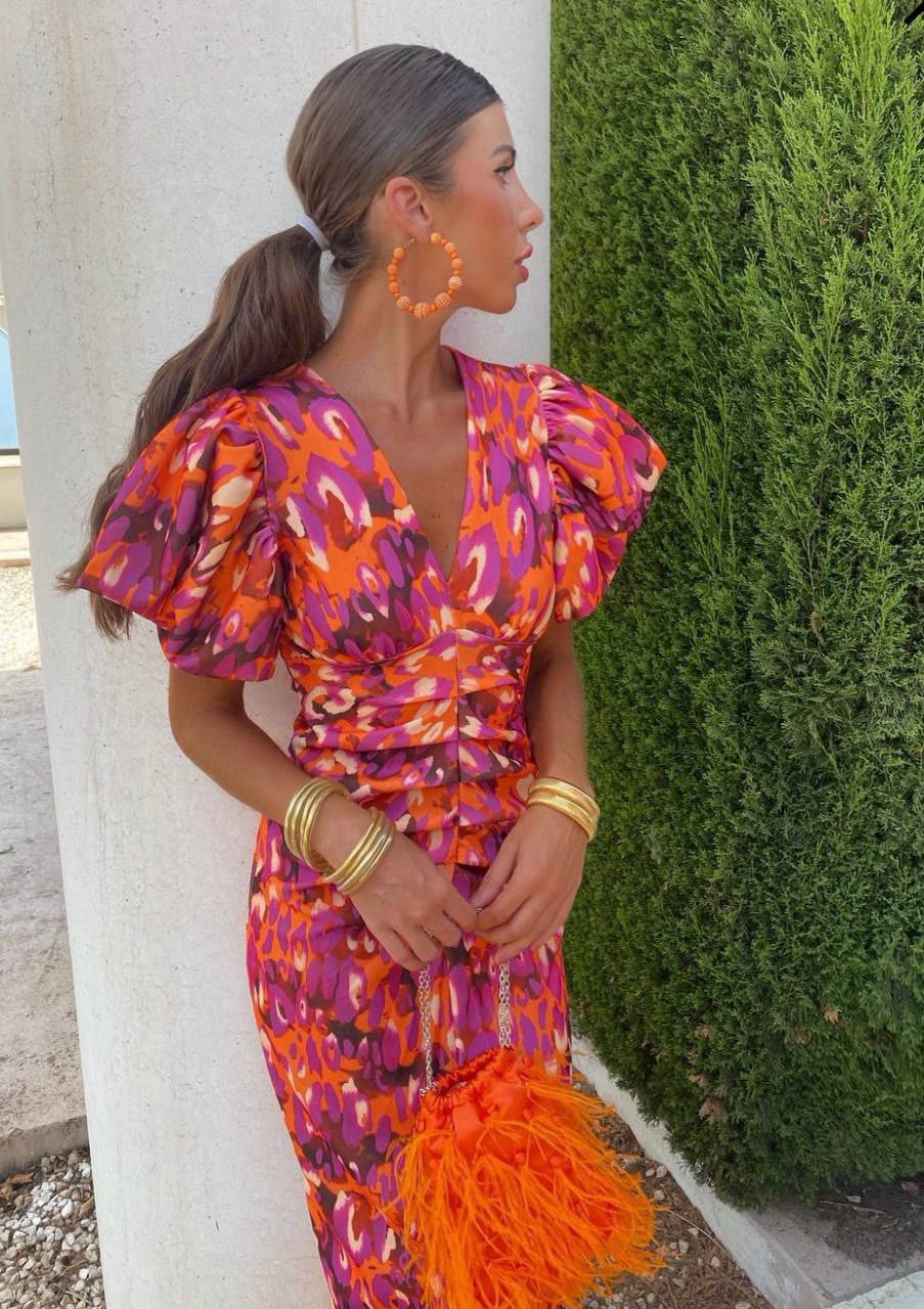 Women's elegant floral summer dress with puff sleeves & V-neck, vibrant print for stylish comfort.