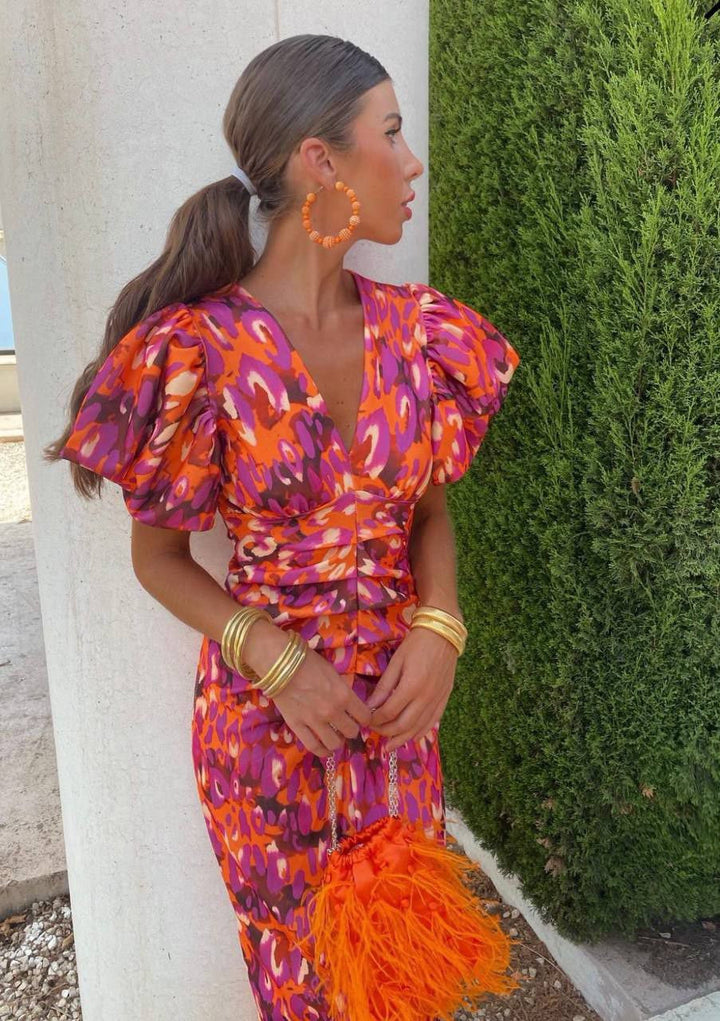 Women's elegant floral summer dress with puff sleeves & V-neck, vibrant print for stylish comfort.