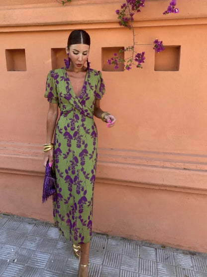 Vibrant floral summer dress for women, an elegant puff sleeve V-neck style perfect for parties.