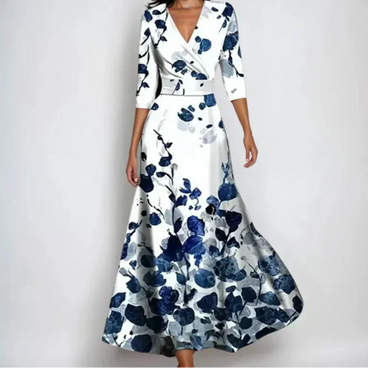 Women's elegant floral wrap midi dress with three-quarter sleeves, perfect for summer occasions. Feminine patterned dress.