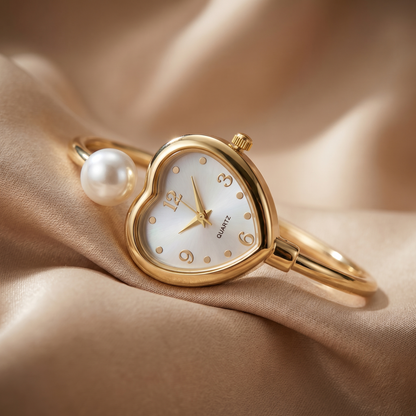 Elegant women's gold watch with pearl bracelet and heart accent. A modern jewelry piece for any occasion.