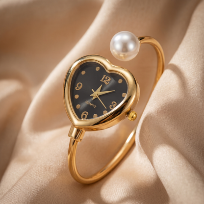 Women's quartz watch: gold bracelet, modern pearl details, and a sweet heart charm. Stylish & accurate.