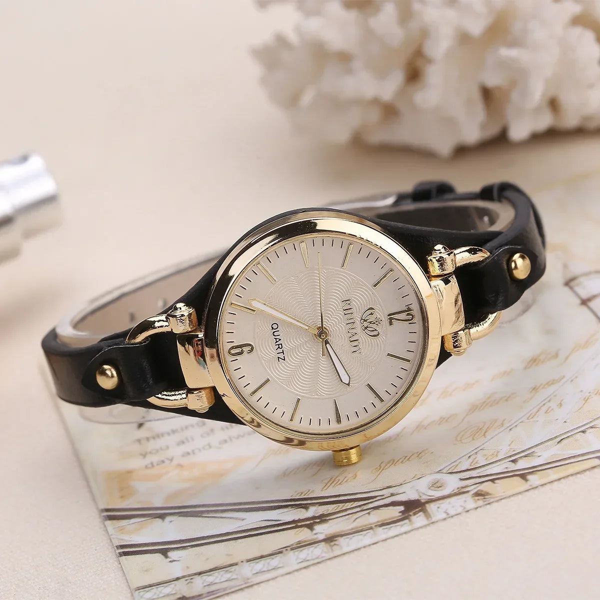 Stylish women's elegant gold quartz watch, a perfect fashion accessory gift with a vegan leather strap.