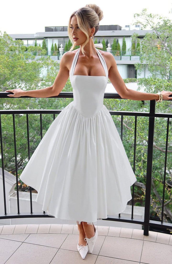 Women's elegant halter neck midi cocktail dress, perfect for sophisticated evening wear.