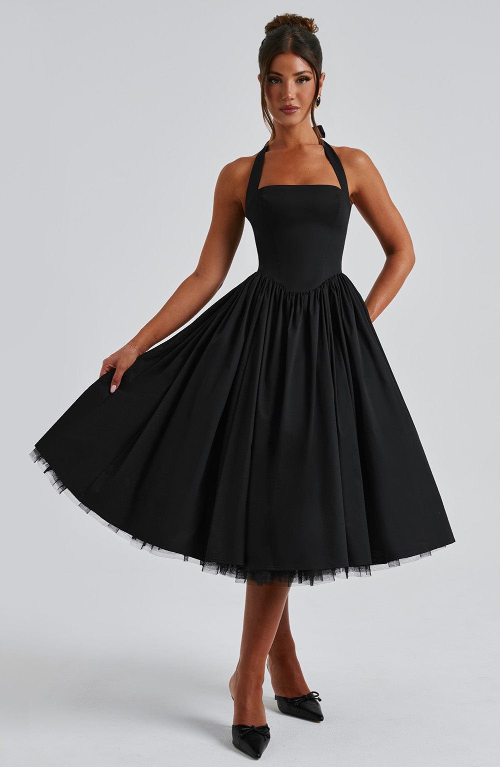 Elegant flared midi dress with a halter neck for women, perfect for cocktail and evening events.