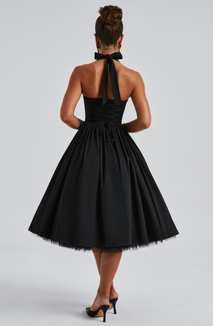Women's sophisticated halter neck midi dress with a flared silhouette, perfect for formal parties.