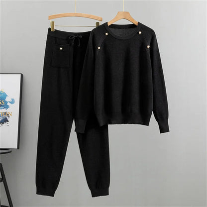 Women's elegant knit lounge set with pearl embellishments. Comfortable two-piece sweater & jogger for casual fall/winter wear.