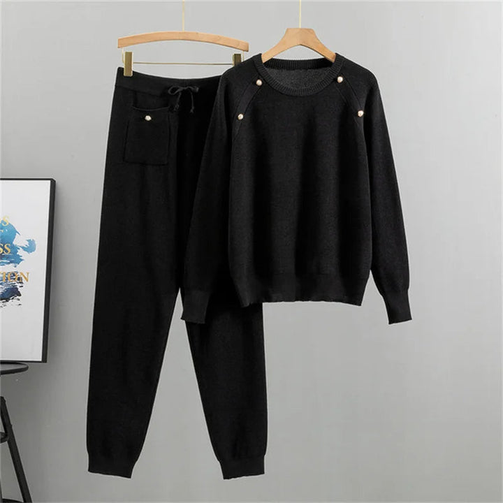 Women's elegant knit lounge set with pearl embellishments. Comfortable two-piece sweater & jogger for casual fall/winter wear.