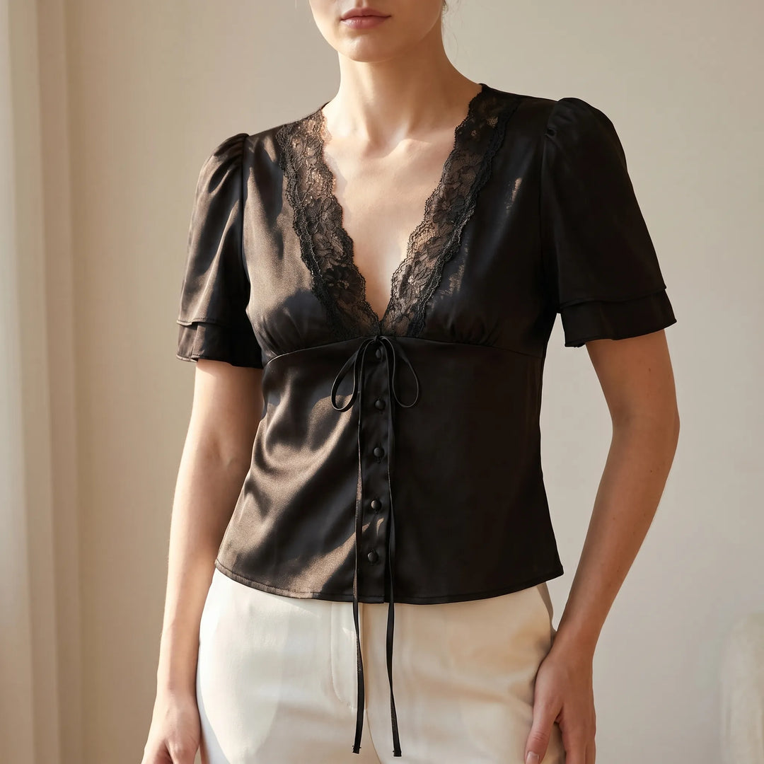 Women's elegant lace-trim blouse with short flutter sleeves, V-neck, and button front; perfect for day-to-night wear.