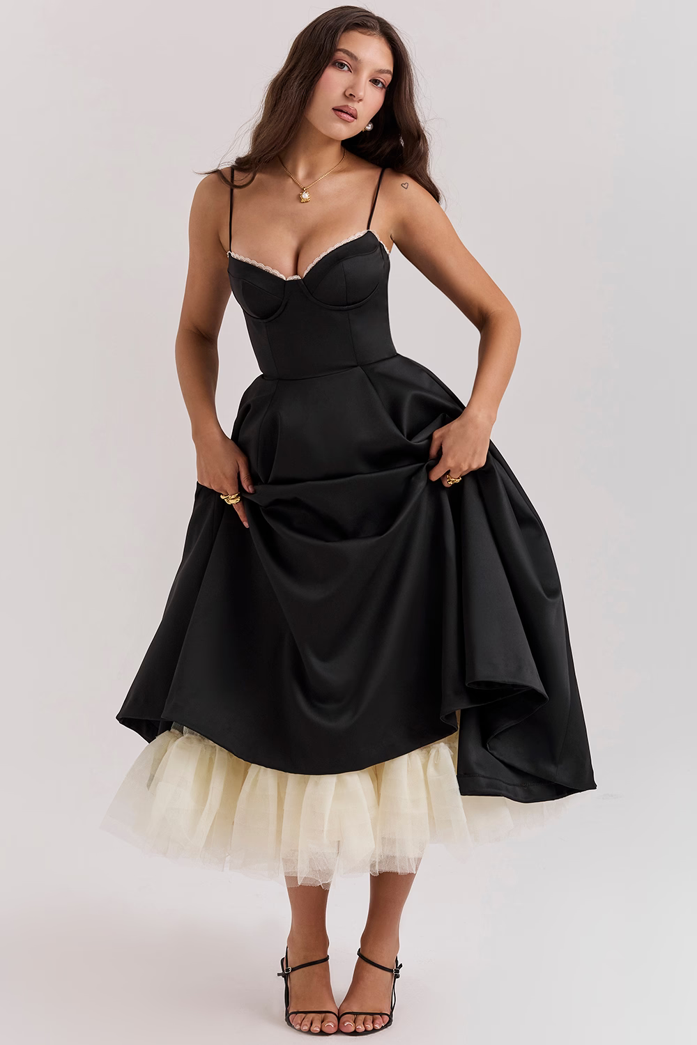 Side view of a women's stylish midi dress, highlighting its corset bodice, lace details, pockets, and elegant flow.