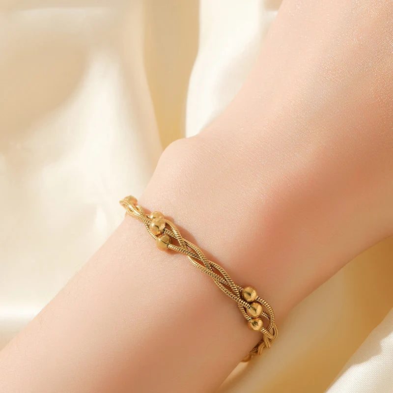 Stylish gold-tone layered chain bracelet for women, made from durable stainless steel jewelry.