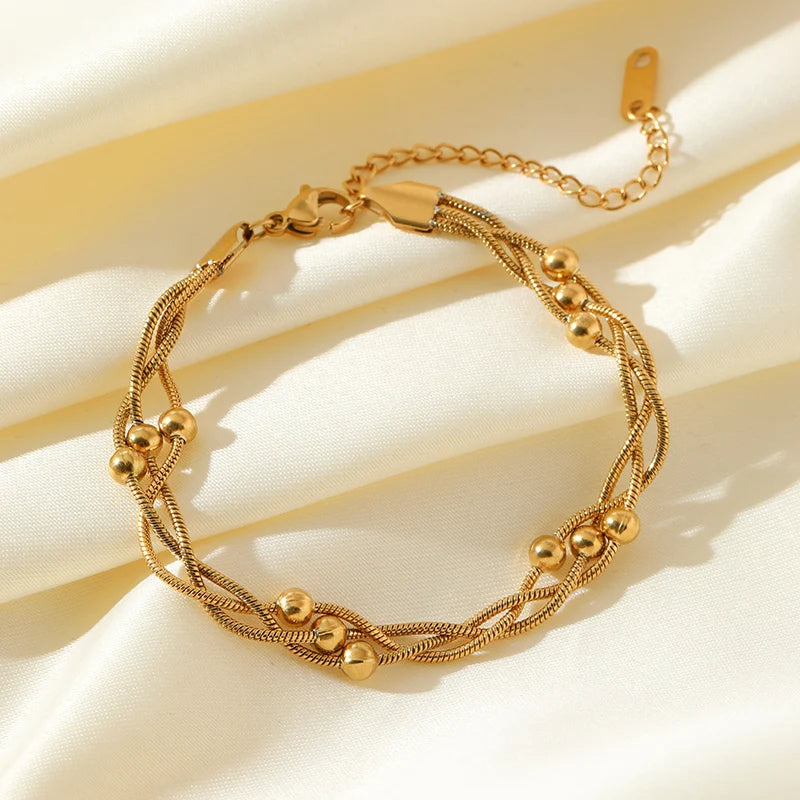 Elegant silver-tone layered chain bracelet, a versatile women's jewelry fashion accessory.