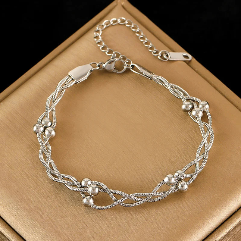 Delicate layered chain bracelet, a stunning gold or silver-tone women's elegant jewelry piece.