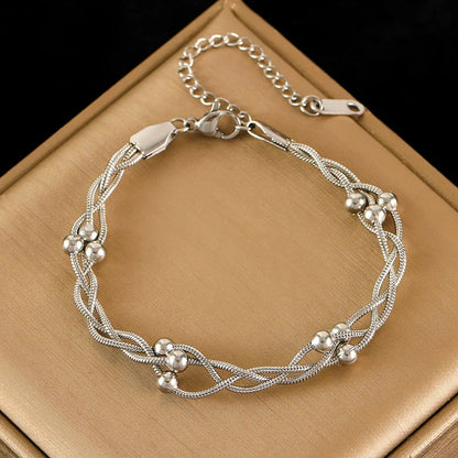 Delicate layered chain bracelet, a stunning gold or silver-tone women's elegant jewelry piece.