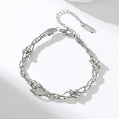Women's layered chain bracelet, an elegant and trendy fashion accessory for any outfit.