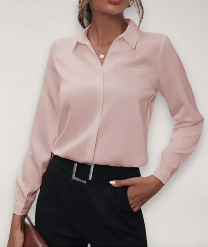 Professional women's button-down blouse, ideal for office wear and formal events. Elegant long-sleeve work shirt.