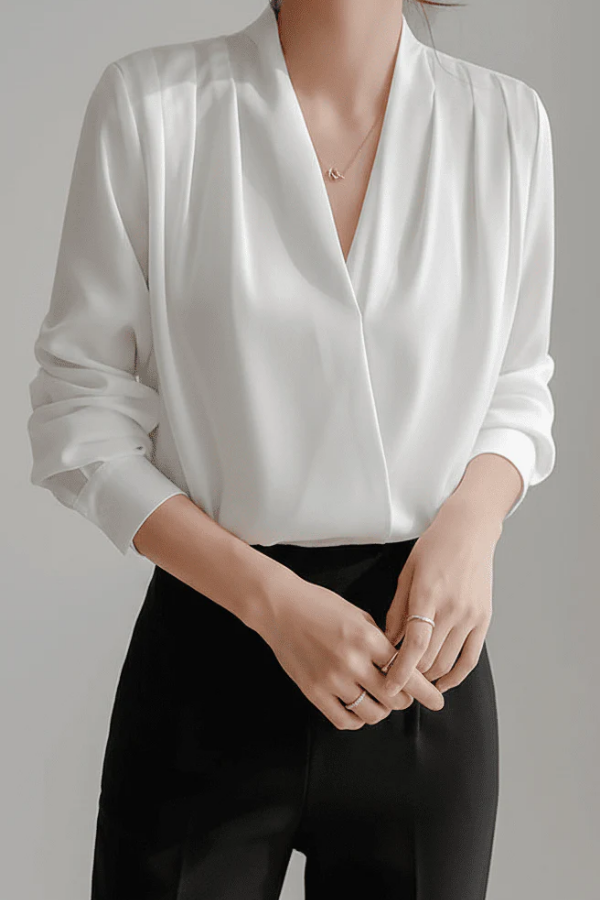 Stylish women's long sleeve wrap blouse in a modern design. An elegant ladies top for various occasions.